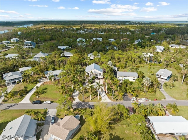 10610 Habitat Trl, Bokeelia, FL 33922 - aerial view of property and surrounding area with nearby suburban area