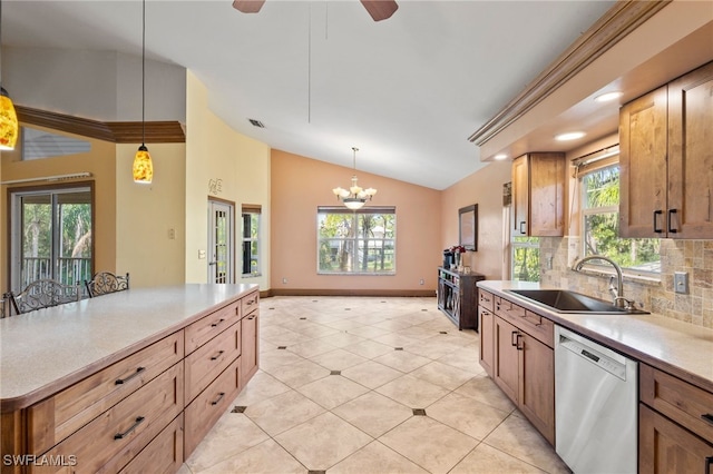 10610 Habitat Trl, Bokeelia, FL 33922 - kitchen with dishwasher, a sink, vaulted ceiling, hanging light fixtures, and a chandelier