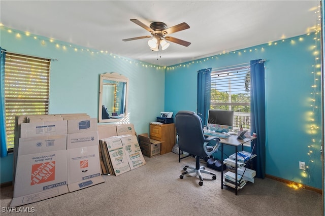 home office featuring carpet and ceiling fan