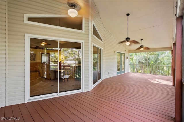 wooden deck featuring ceiling fan