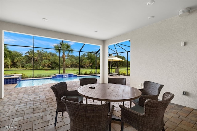 view of patio / terrace featuring a lanai and pool water feature