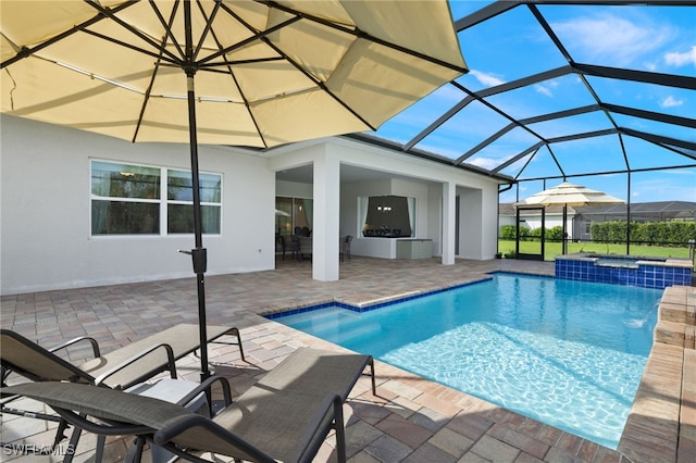 view of swimming pool with a patio and glass enclosure