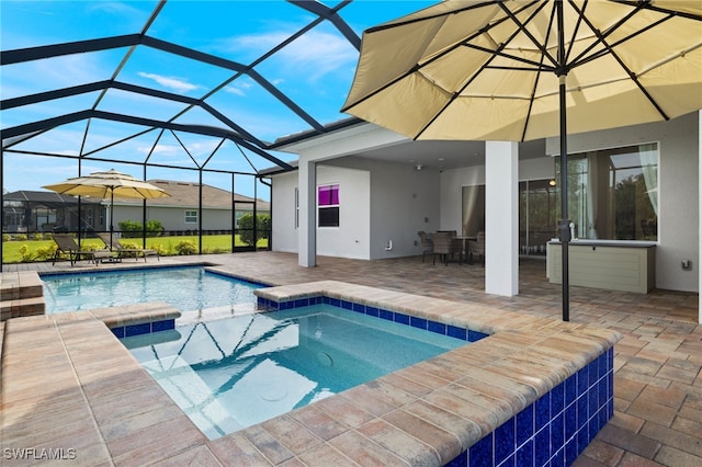 view of swimming pool with a patio, glass enclosure, and an in ground hot tub