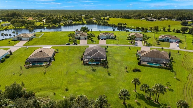 birds eye view of property featuring a water view and a rural view