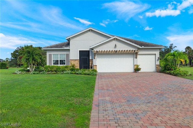 view of front of home featuring a garage and a front lawn