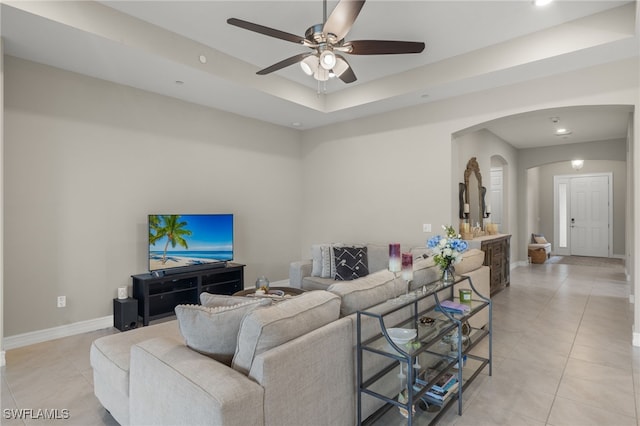 living room featuring light tile patterned floors and ceiling fan