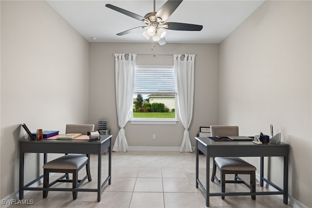 tiled office space featuring ceiling fan