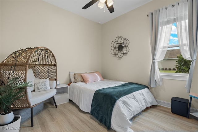 bedroom featuring light wood-type flooring and ceiling fan