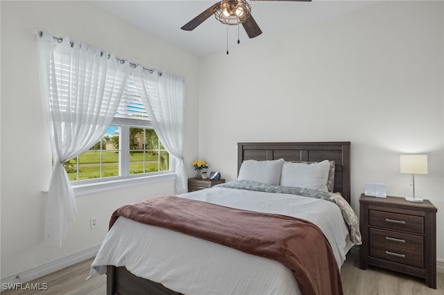 bedroom featuring light hardwood / wood-style floors and ceiling fan