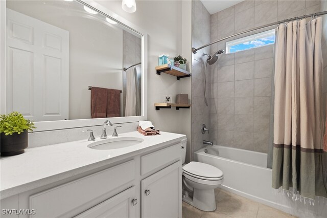 full bathroom with shower / tub combo, vanity, toilet, and tile patterned floors