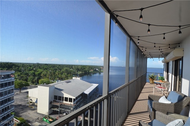 balcony featuring a water view