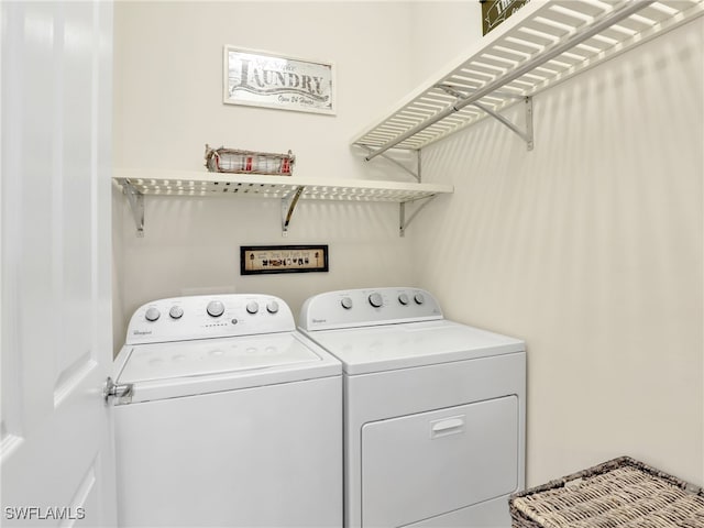 laundry room featuring separate washer and dryer