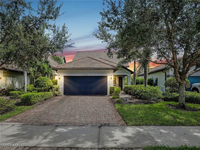 view of front of property with a garage