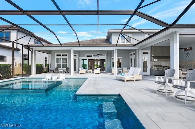 view of pool with ceiling fan, glass enclosure, an in ground hot tub, and a patio area