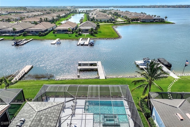 birds eye view of property featuring a water view