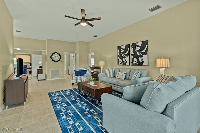 tiled living room featuring ceiling fan