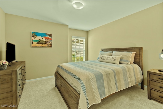 bedroom with light colored carpet