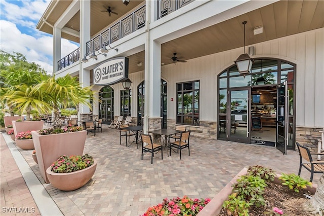 view of patio featuring a balcony and ceiling fan