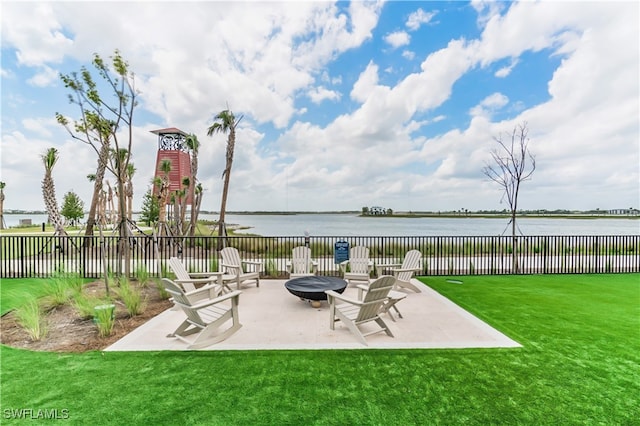 view of patio / terrace featuring a water view and an outdoor fire pit