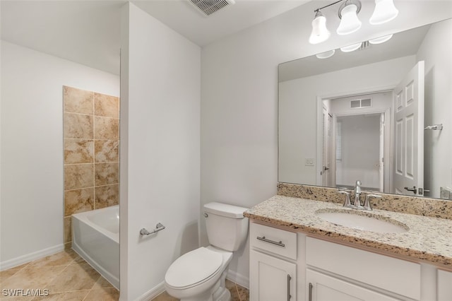 bathroom with tile patterned flooring, a bath, vanity, and toilet