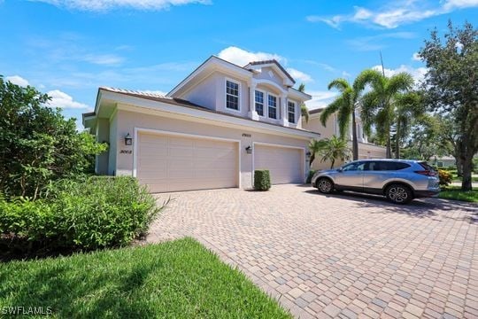 front of property with a garage