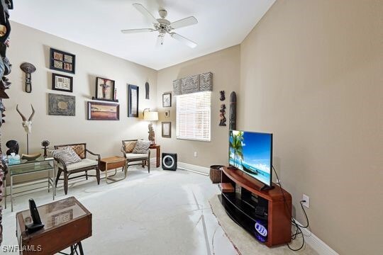 living area with ceiling fan