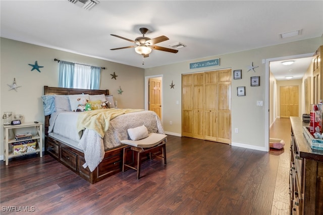 bedroom with ceiling fan and dark hardwood / wood-style flooring