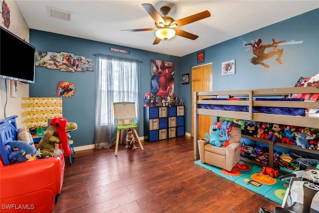 bedroom with ceiling fan and dark hardwood / wood-style floors