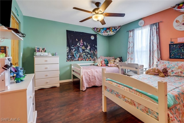 bedroom with ceiling fan and dark hardwood / wood-style floors