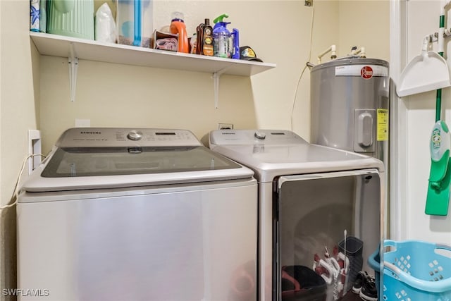 clothes washing area featuring separate washer and dryer