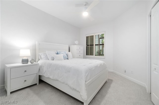 bedroom with ceiling fan and light colored carpet