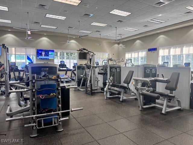 exercise room featuring a paneled ceiling