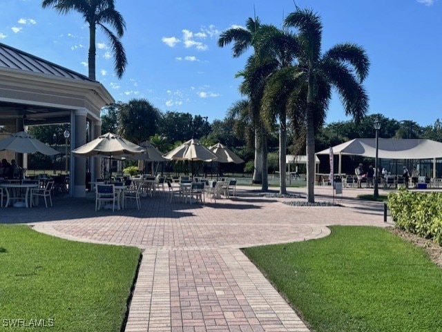 view of community with a patio and a yard