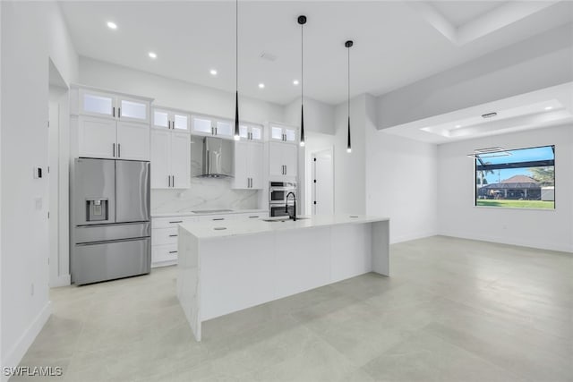 kitchen featuring stainless steel appliances, wall chimney exhaust hood, glass insert cabinets, and white cabinets