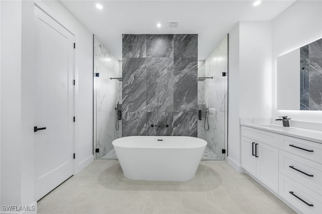 full bath with marble finish floor, recessed lighting, a marble finish shower, and vanity