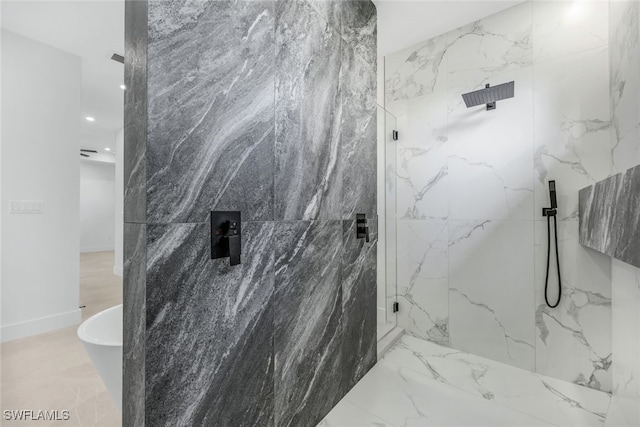 full bathroom with marble finish floor, a soaking tub, and a marble finish shower