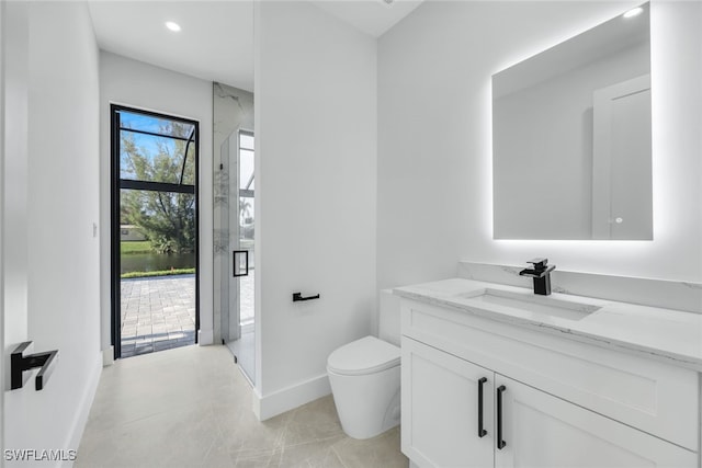 full bathroom with a marble finish shower, recessed lighting, toilet, vanity, and baseboards