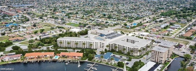 bird's eye view featuring a view of city and a water view