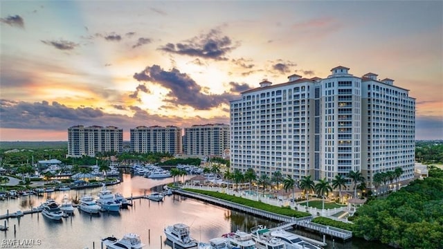 exterior space featuring a water view and a city view