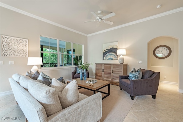 living room featuring ceiling fan, ornamental molding, and light tile patterned flooring