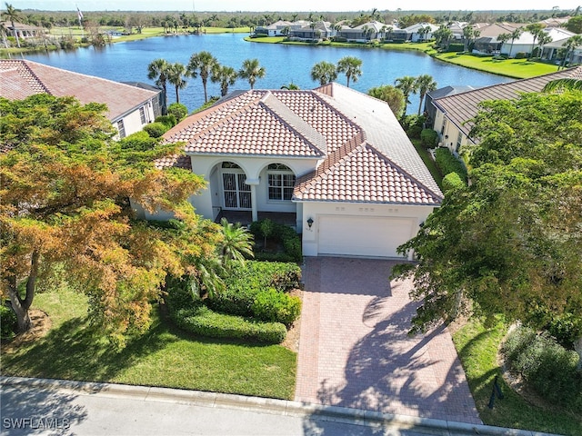 birds eye view of property featuring a water view