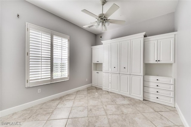 unfurnished bedroom featuring ceiling fan, a closet, and light tile patterned floors