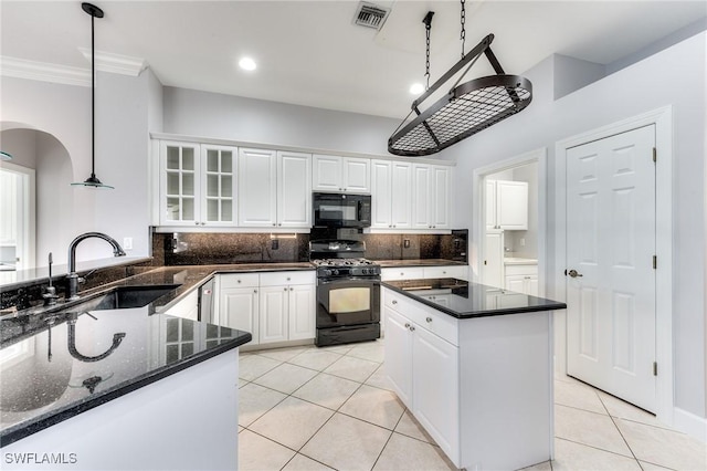 kitchen featuring pendant lighting, white cabinetry, light tile patterned floors, and black appliances