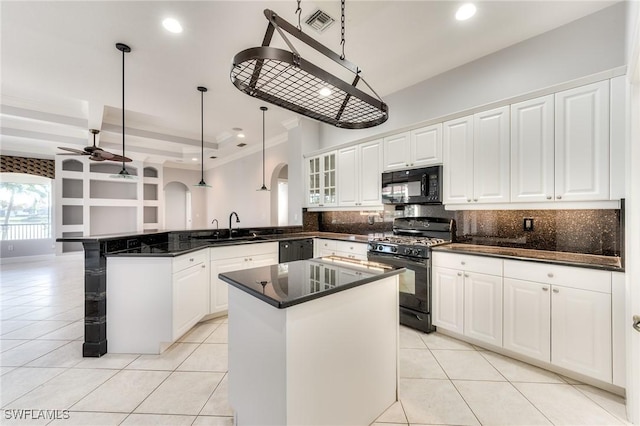 kitchen featuring white cabinetry, a center island, black appliances, decorative light fixtures, and kitchen peninsula