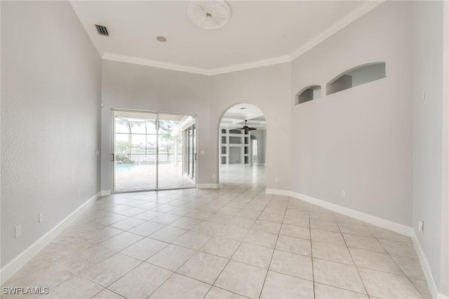 tiled empty room featuring crown molding and ceiling fan