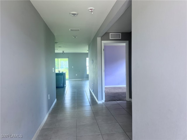 hallway with light tile patterned floors