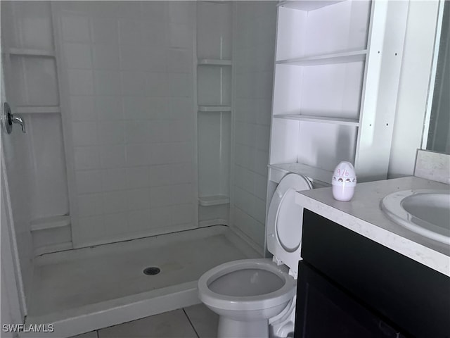 bathroom with tile patterned floors, a shower, vanity, and toilet