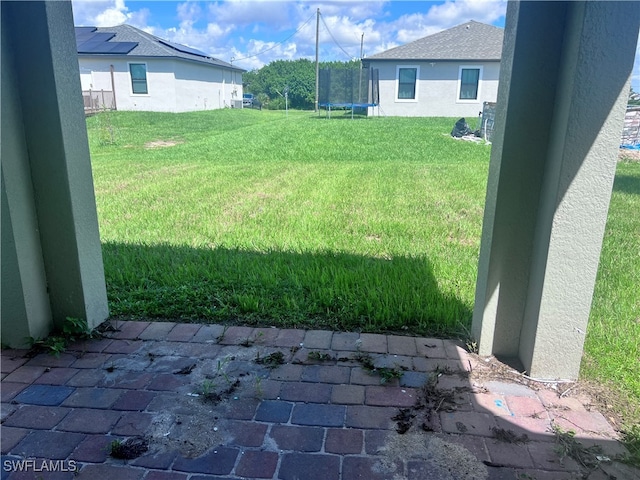 view of yard featuring a trampoline