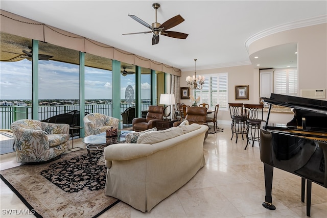 living room with ceiling fan with notable chandelier and crown molding