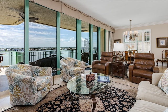 tiled living room featuring ceiling fan with notable chandelier, ornamental molding, a water view, and a healthy amount of sunlight